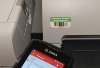 A Zebra asset scanning phone pointing towards a nearby barcode. 