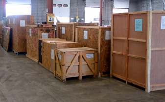 A grouping of wooden storage boxes inside a warehouse