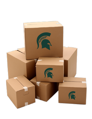 A stack of brown cardboard boxes with some of the boxes having a green Michigan State Spartan helmet logo on the side.